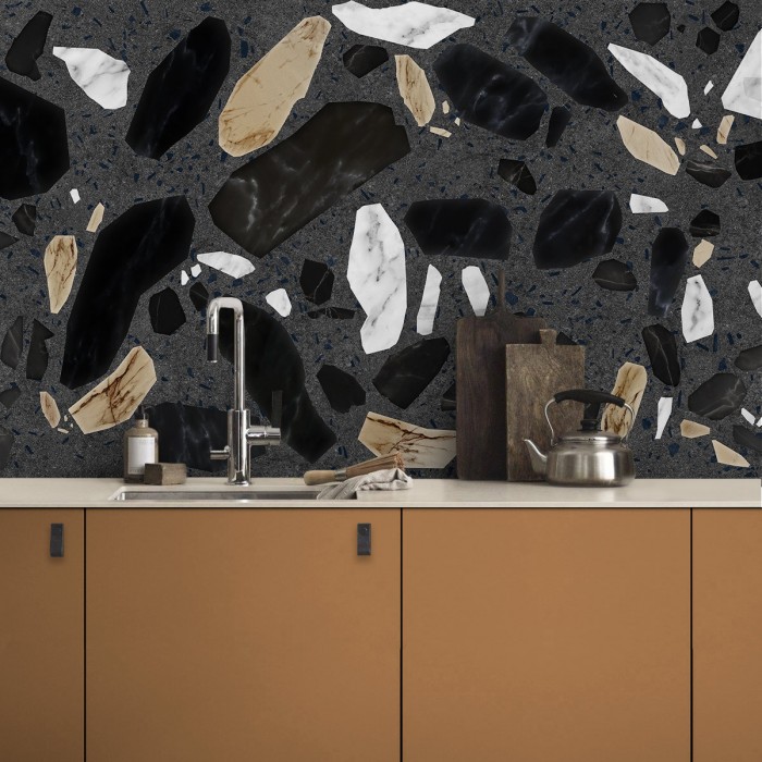 Terrazo Correr - vinilo lavable autoadhesivo para paredes de cocina en tonos tierra, blancos y negros sobre gris oscuro.